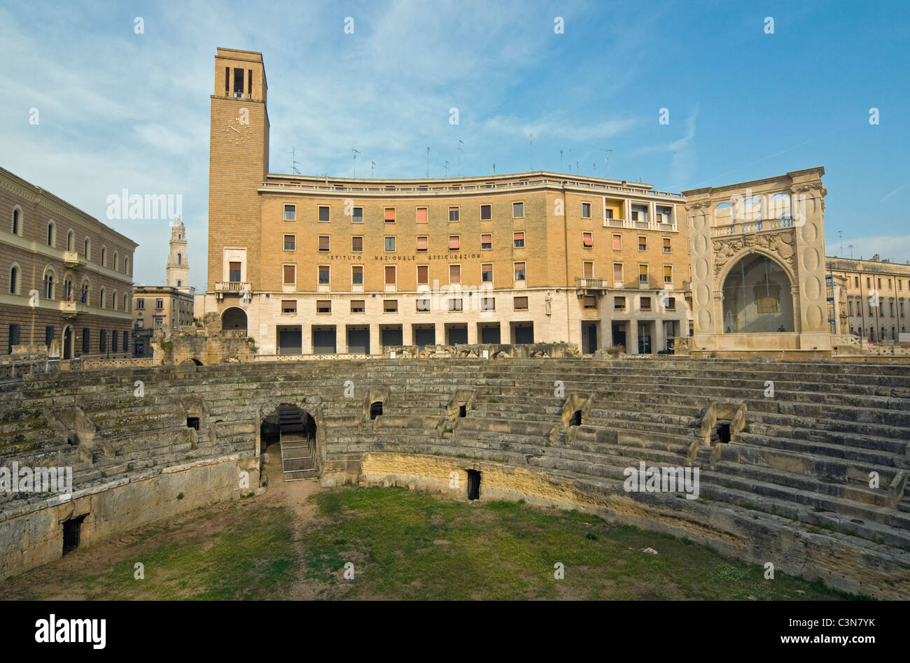 Roman Amphitheatre and INA Building (Italian Rationalist-Fascist Architecture), Sant'Oronzo Sq., Lecce, Apulia (Puglia), Italy Stock Photo
