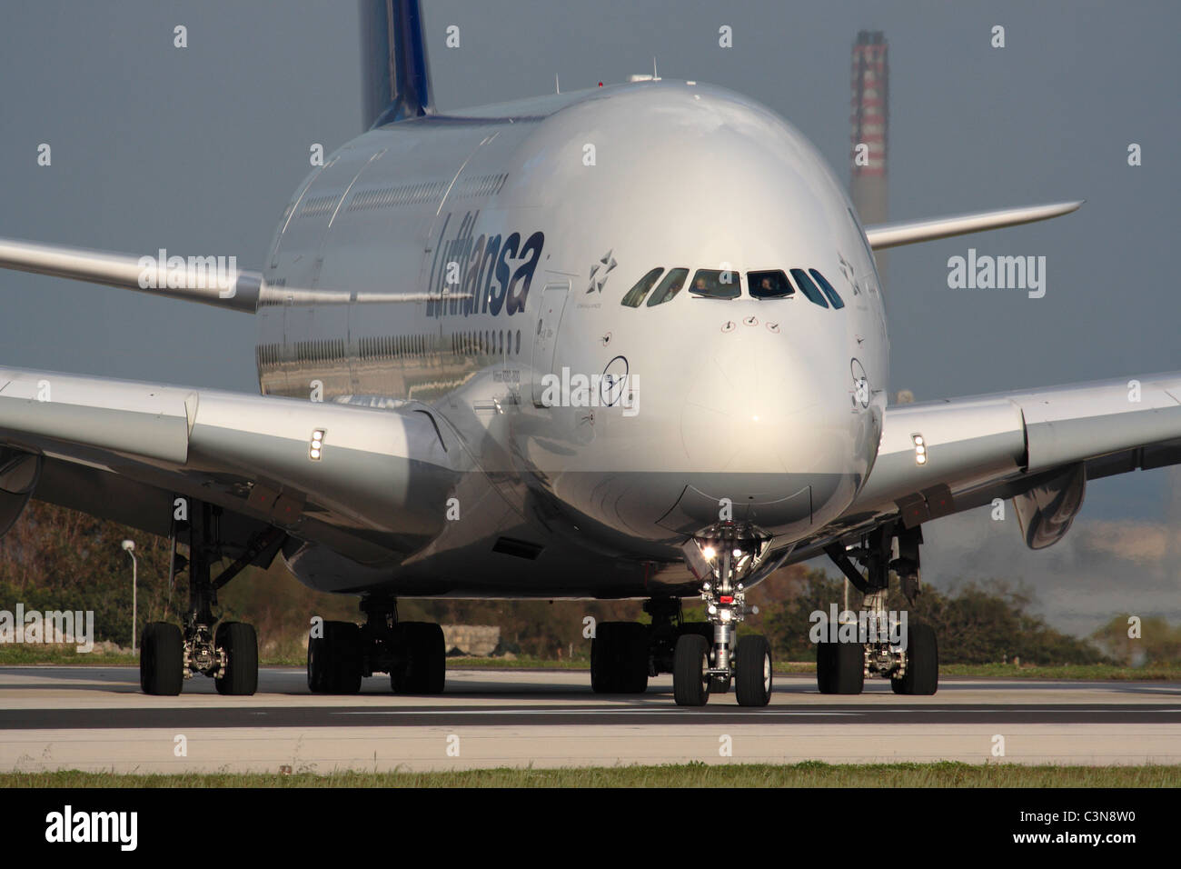 Lufthansa Airbus A380 long-haul passenger jet lining up for departure from Malta. Closeup front view emphasizing the large size of this plane. Stock Photo