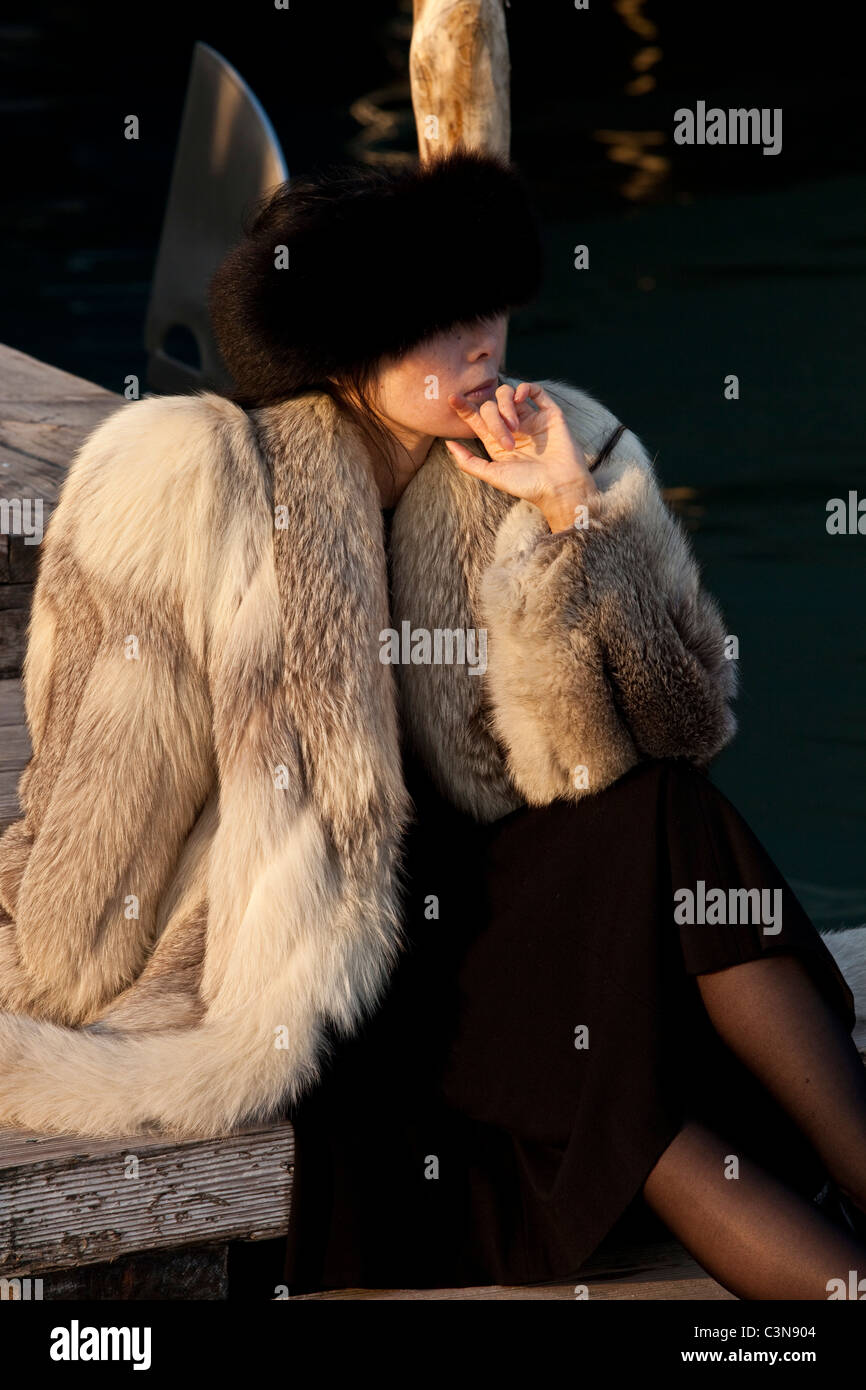 Wealthy tourist sitting down outside the Danieli hotel, Venice, Italy Stock Photo