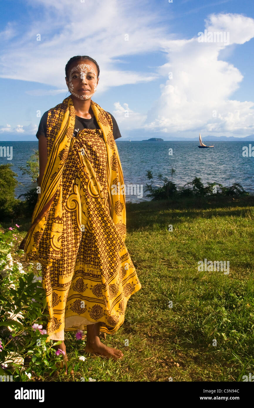 Malagasy woman with typical mask of the Sakalava ethnic group in Nosy Be, Madagascar Stock Photo