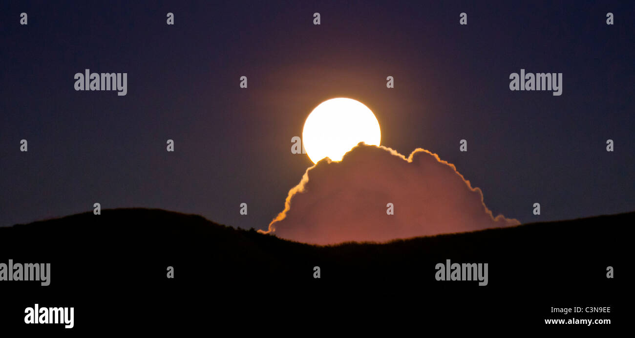 Full moon rising over mystic clouds, Yawasa Islands, Fiji Stock Photo ...