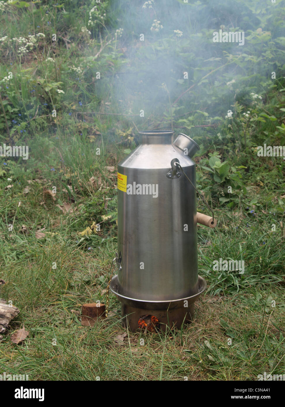 Kelly Kettle boiling water. UK Stock Photo