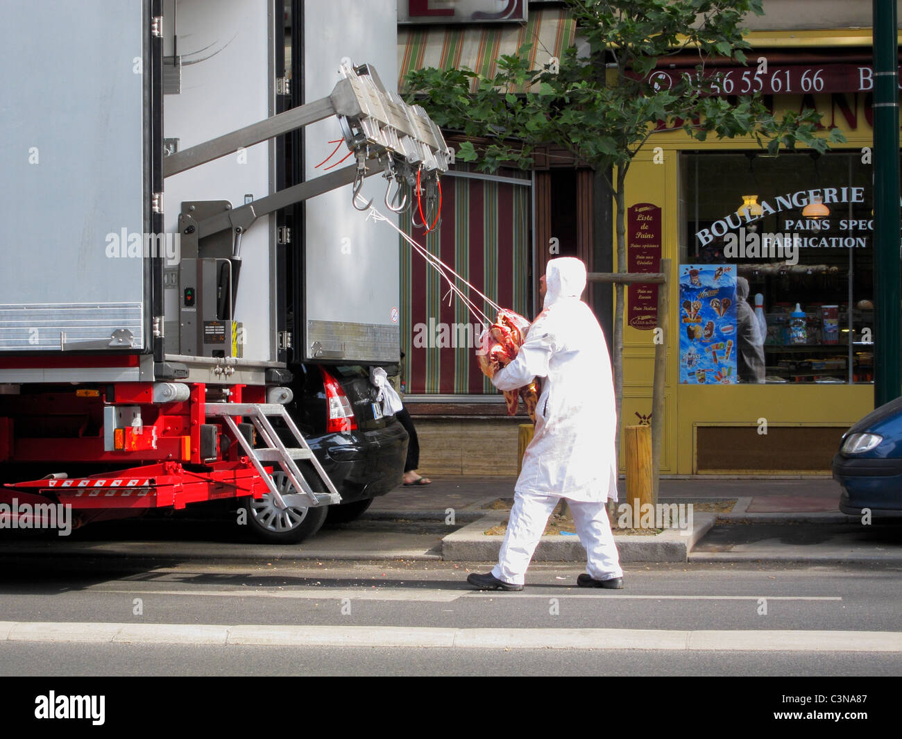 Paris, France, Man Unloading Fresh Halal Meat for French Butcher Shop