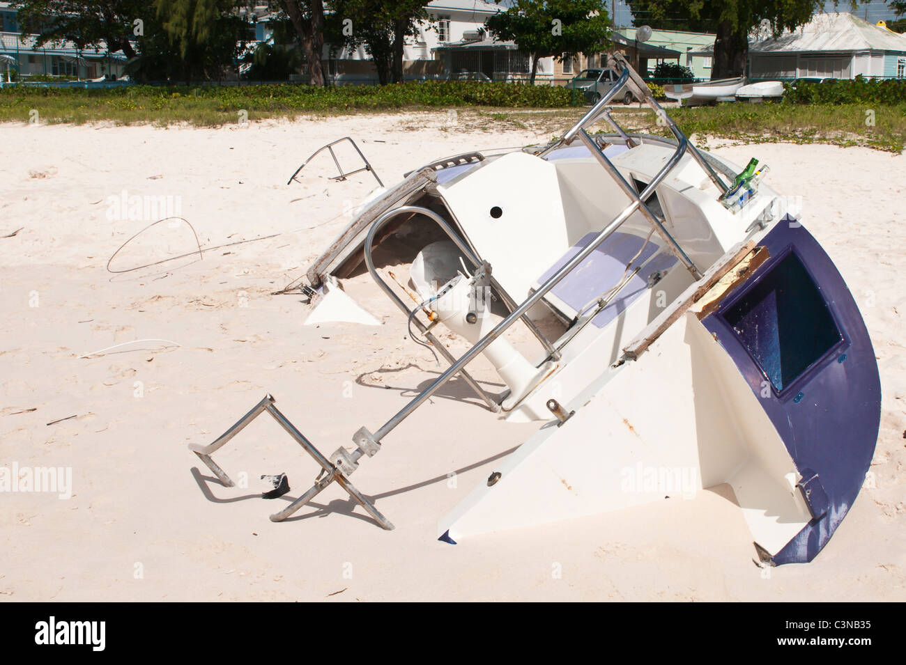 Sailboat wreck from hurrican at Pebbles Beach at Barbados Yacht Club Barbados, Caribbean. Stock Photo