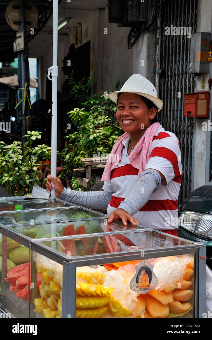 Street food vendor selling fruits. Streets of Bangkok, Thailand Stock