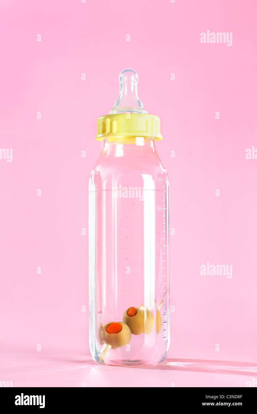 Martini in a baby bottle. Stock Photo