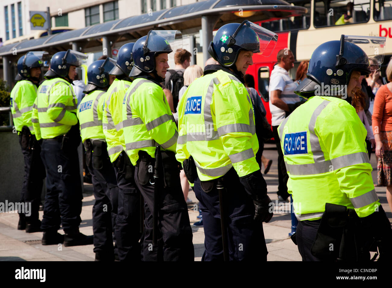 Line of police guard the entrance to Churchill Square, Brighton during Arcadia group protests, UK Stock Photo