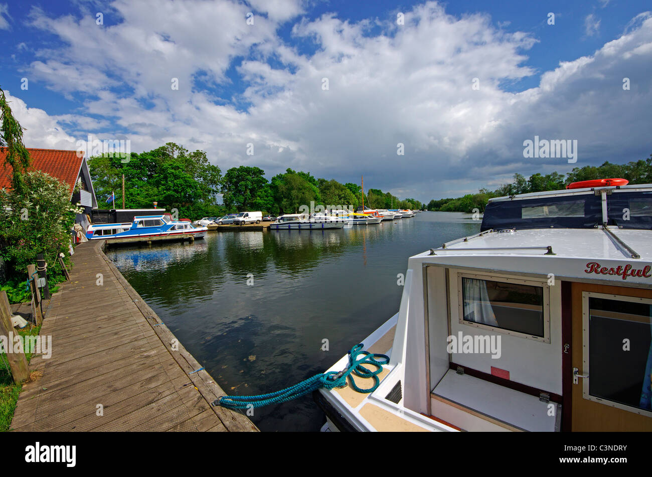rental boats at DRL Marine docks in the Norfolk village of Ludham Stock Photo