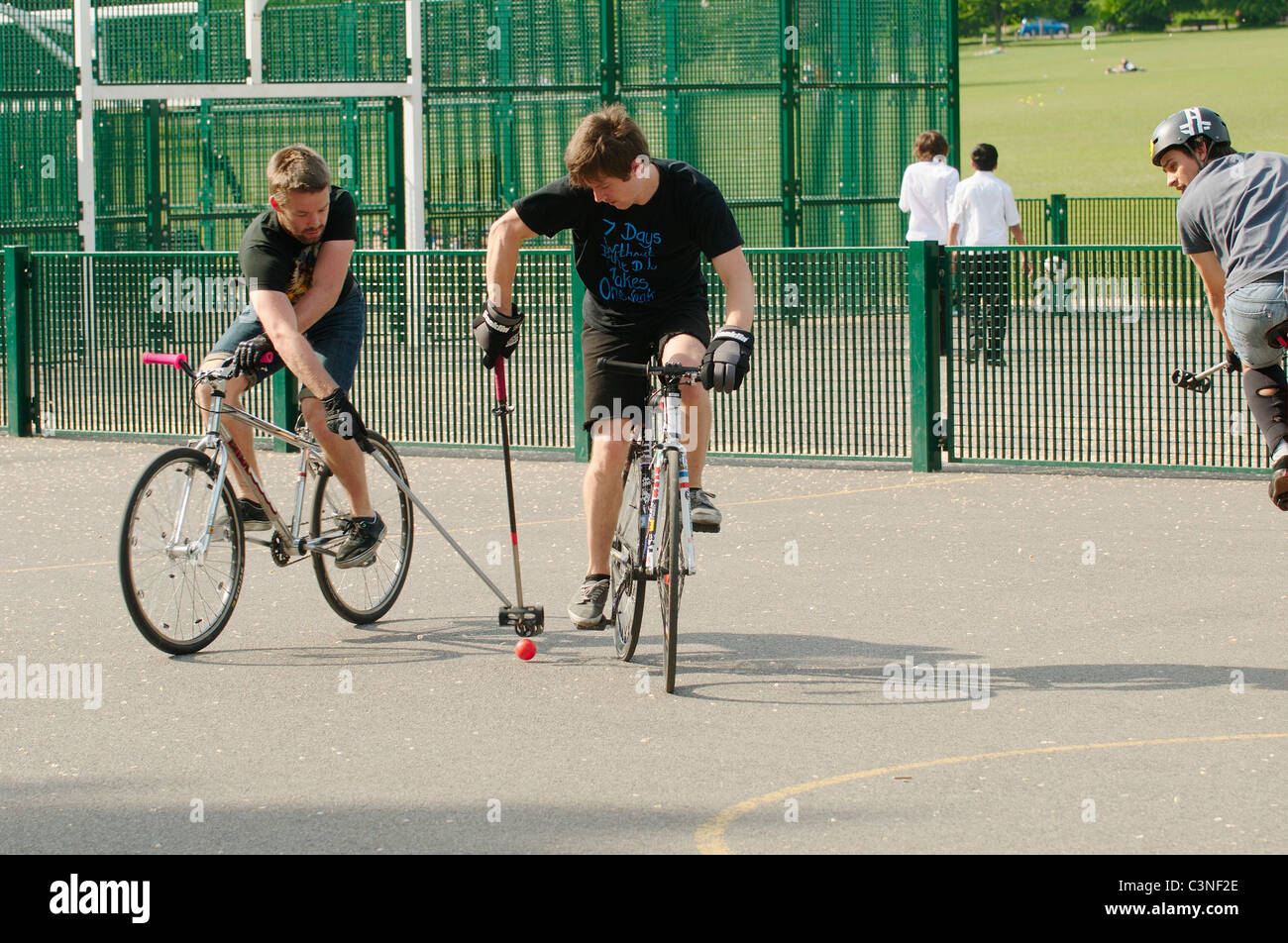 Bicycle Polo in a park in Brighton, England Stock Photo