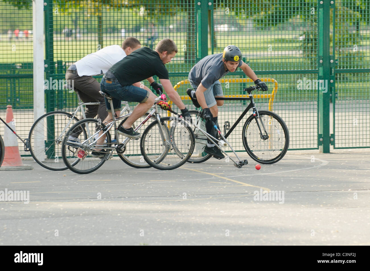 Bicycle Polo in a park in Brighton, England Stock Photo