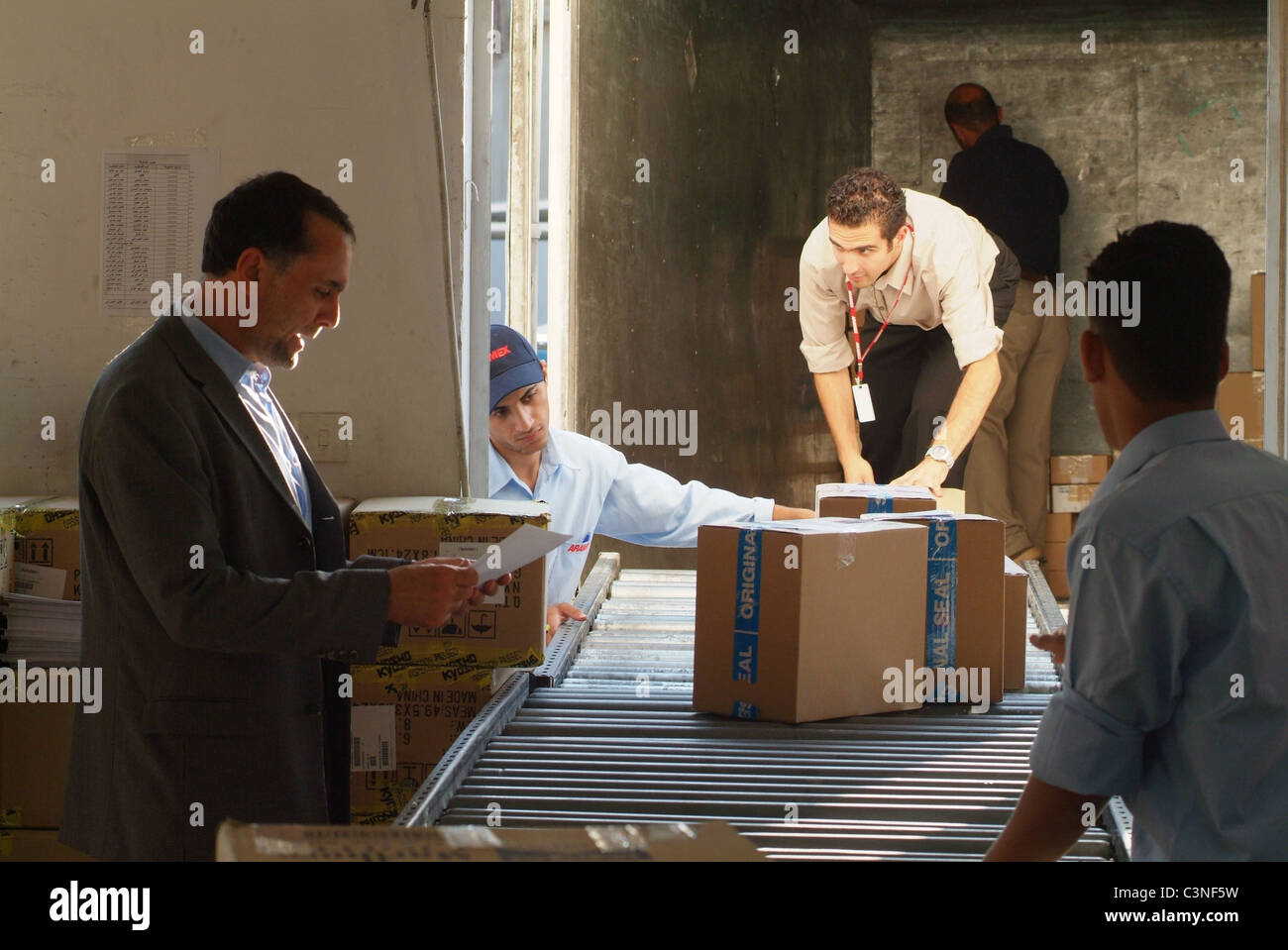 Fadi Ghandour, founder and CEO of ARAMEX, checking up on activity at one of his Amman sorting facilities. Stock Photo