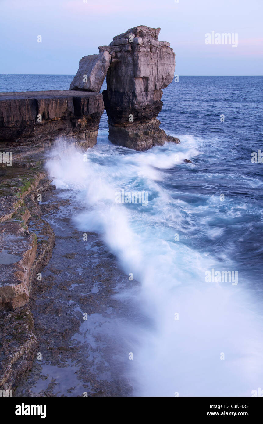 Pulpit Rock in a stormy sea. This massive limestone stack stands just off Portland Bill on the Isle of Portland. Jurassic Coast, Dorset, England, UK. Stock Photo