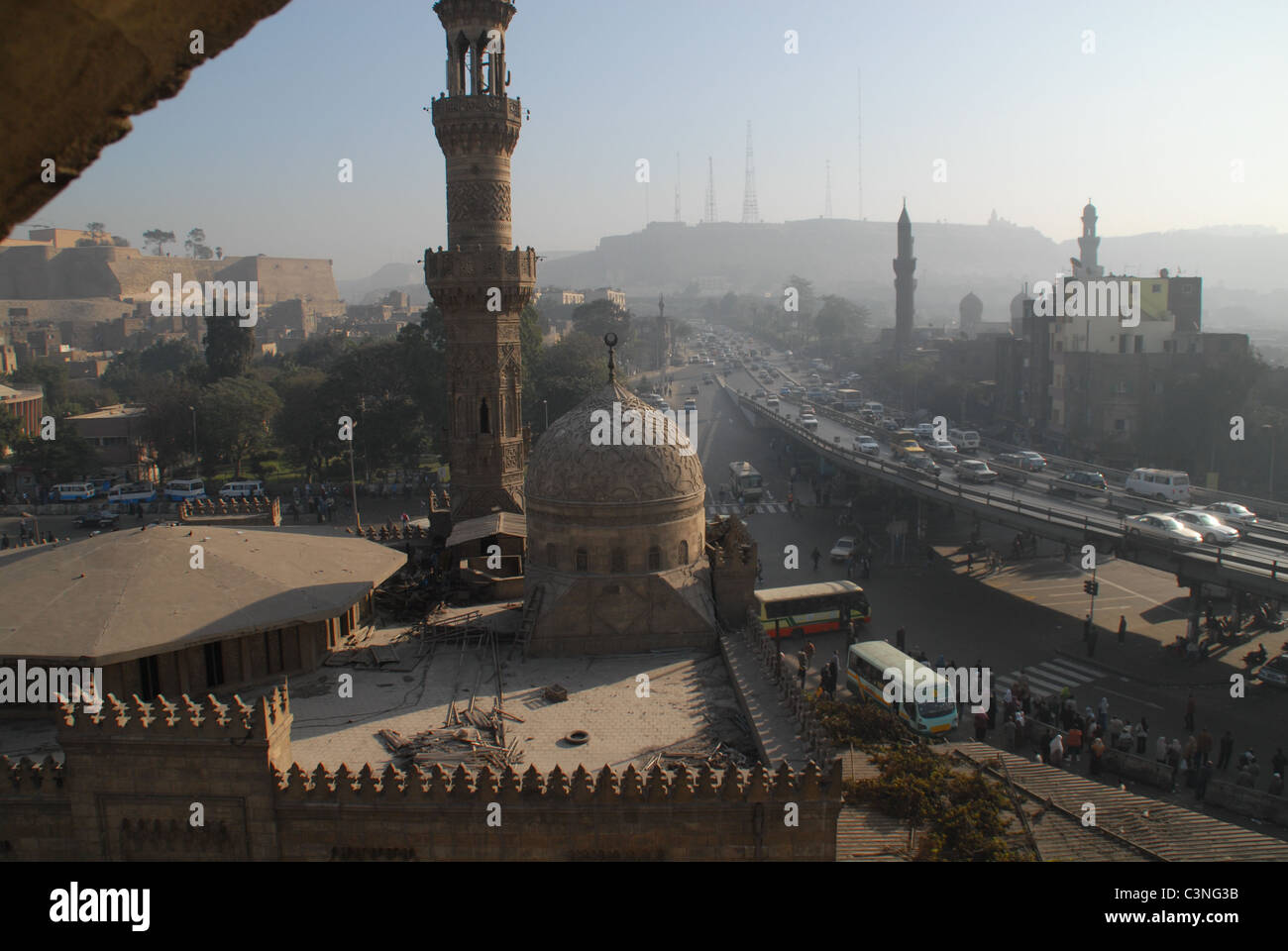 The domes, minarets and traffic congestion of Cairo near the Sayeda Aisha mosque and bridge - near the southern cemetery. Stock Photo