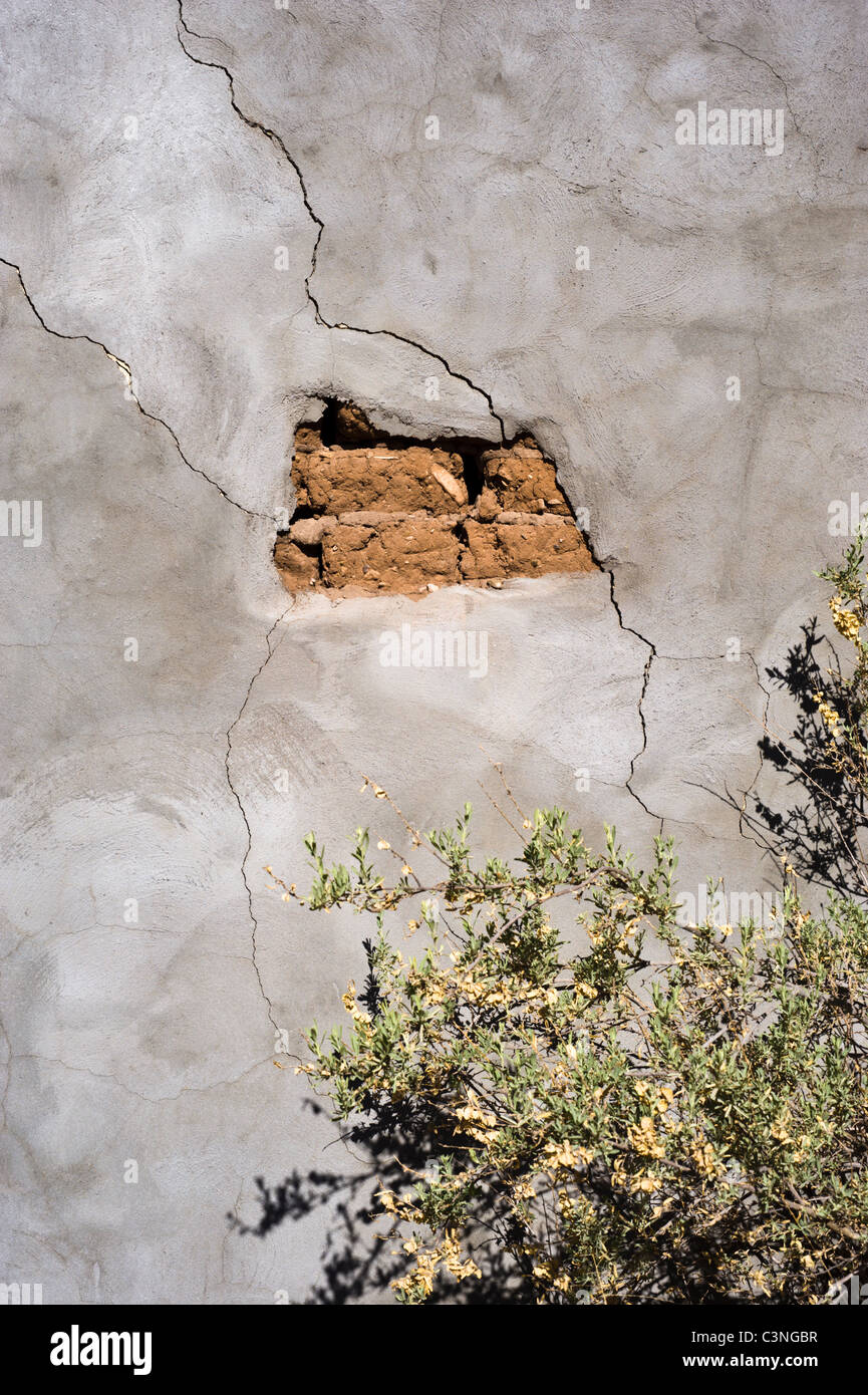Cracking plaster reveals an old adobe wall in the Hondo Valley, Hondo, New Mexico. Stock Photo