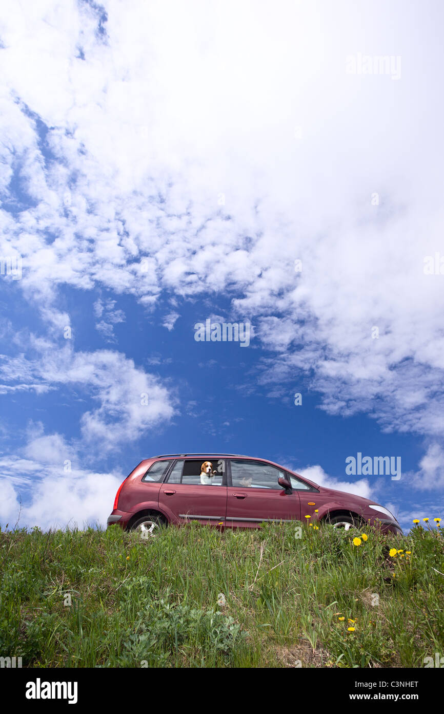 minivan on a background of cloudy sky. Stock Photo