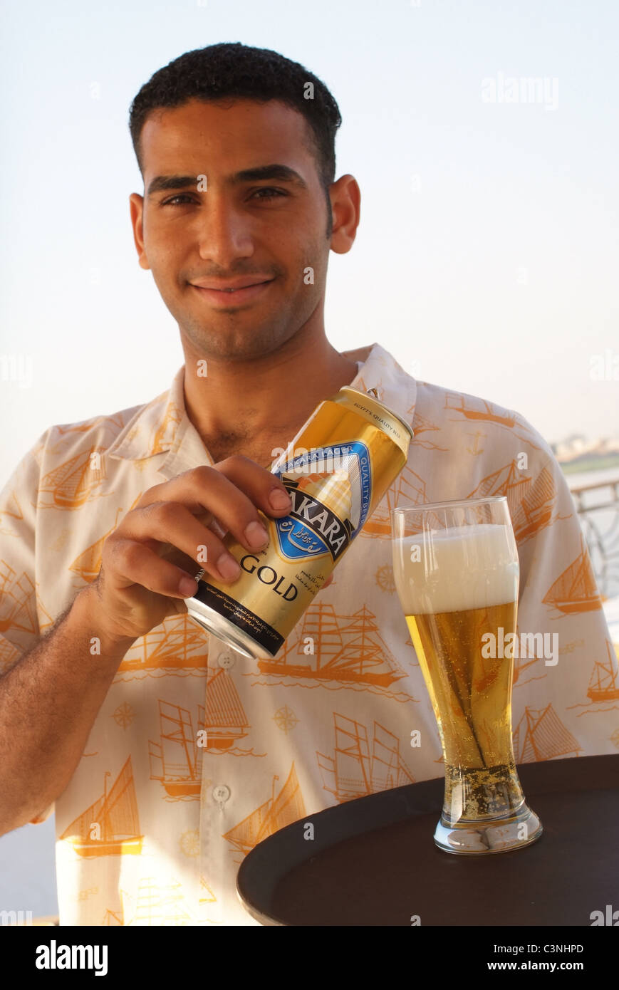 Egypt Waiter Pouring A Sakara Beer For A Passenger On A Nile River 