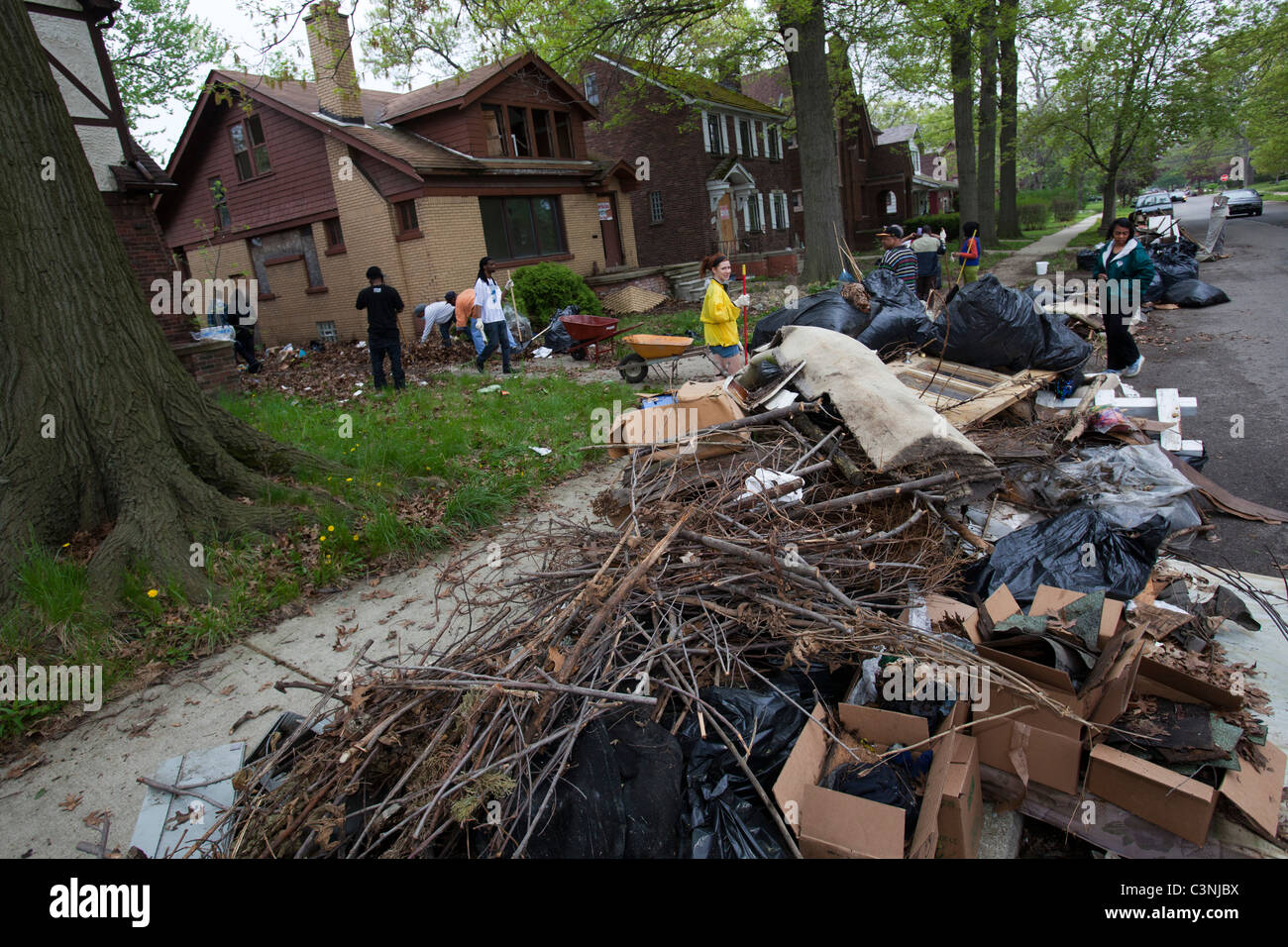 Volunteers Clean Up Trash and Debris at Vacant Homes in Detroit Stock