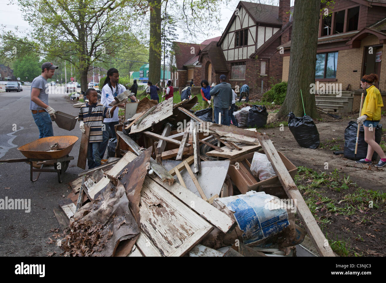 Volunteers Clean Up Trash and Debris at Vacant Homes in Detroit Stock