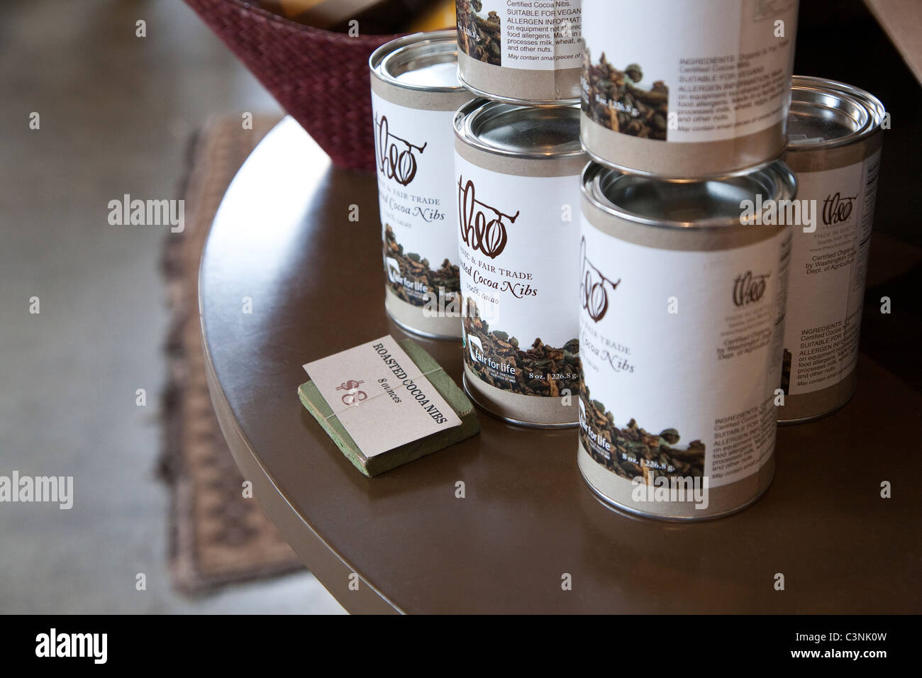 Tins of cocoa nibs for sale at Theo Chocolate Company Stock Photo Alamy