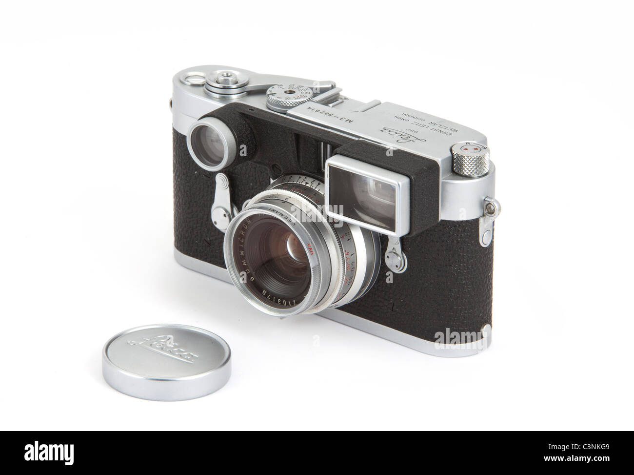 Front of classic Leica M3 camera body  Double stroke 1957 in silver  + 35mm f/2 Summicron, on white background      117909 Leica Stock Photo