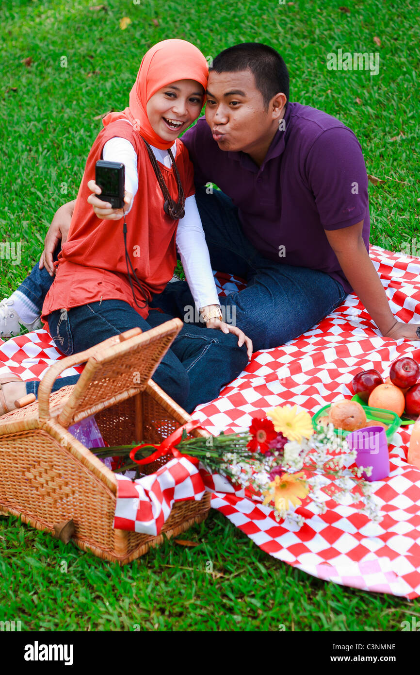 Couple picnic at the park Stock Photo