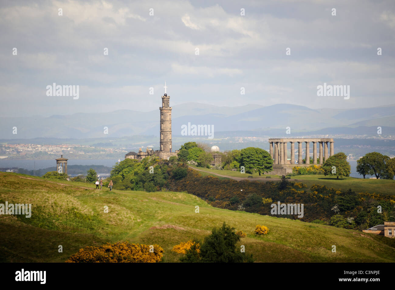 Nelson's Monument and the National Monument on Calton Hill with Salisbury Crags in the foreground in the centre of Edinburgh Stock Photo