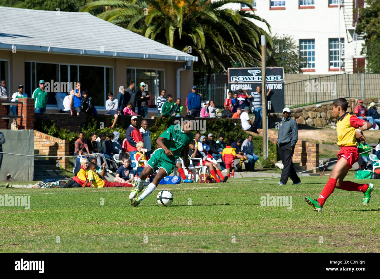 Striker and defender of an U13 football team in a match at Cape Town South Africa Stock Photo