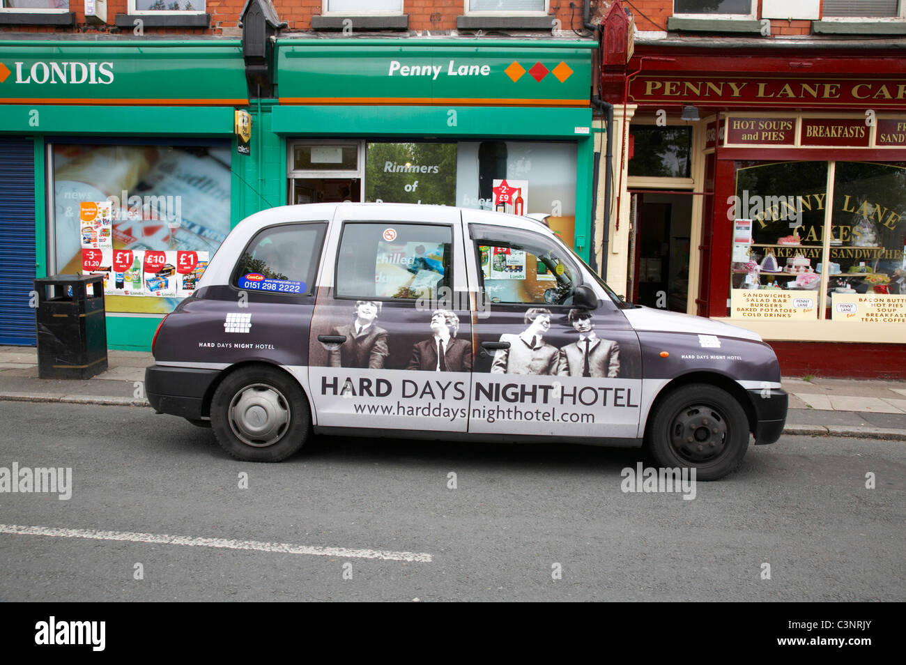 Cab with advert  in Penny Lane Liverpool UK Stock Photo