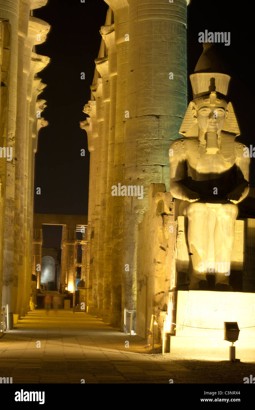 Statue at night in Luxor Temple of Ramses II with columns Stock Photo ...
