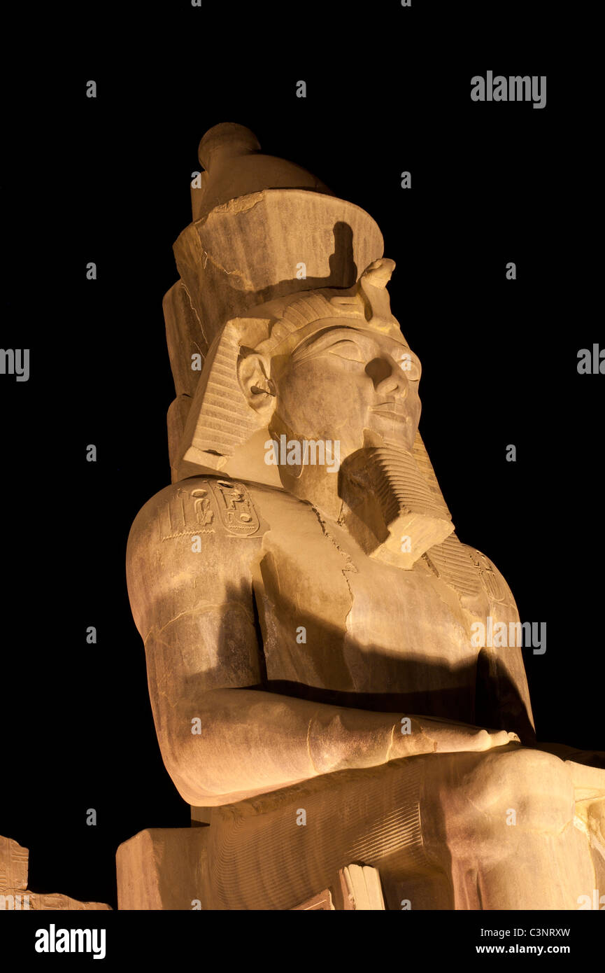 Statue at night in Luxor Temple of Ramses II isolated on black Stock ...