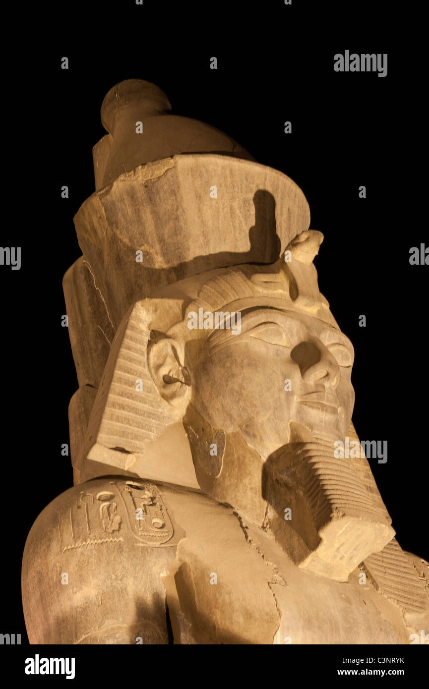 Statue at night in Luxor Temple of Ramses II isolated on black Stock ...