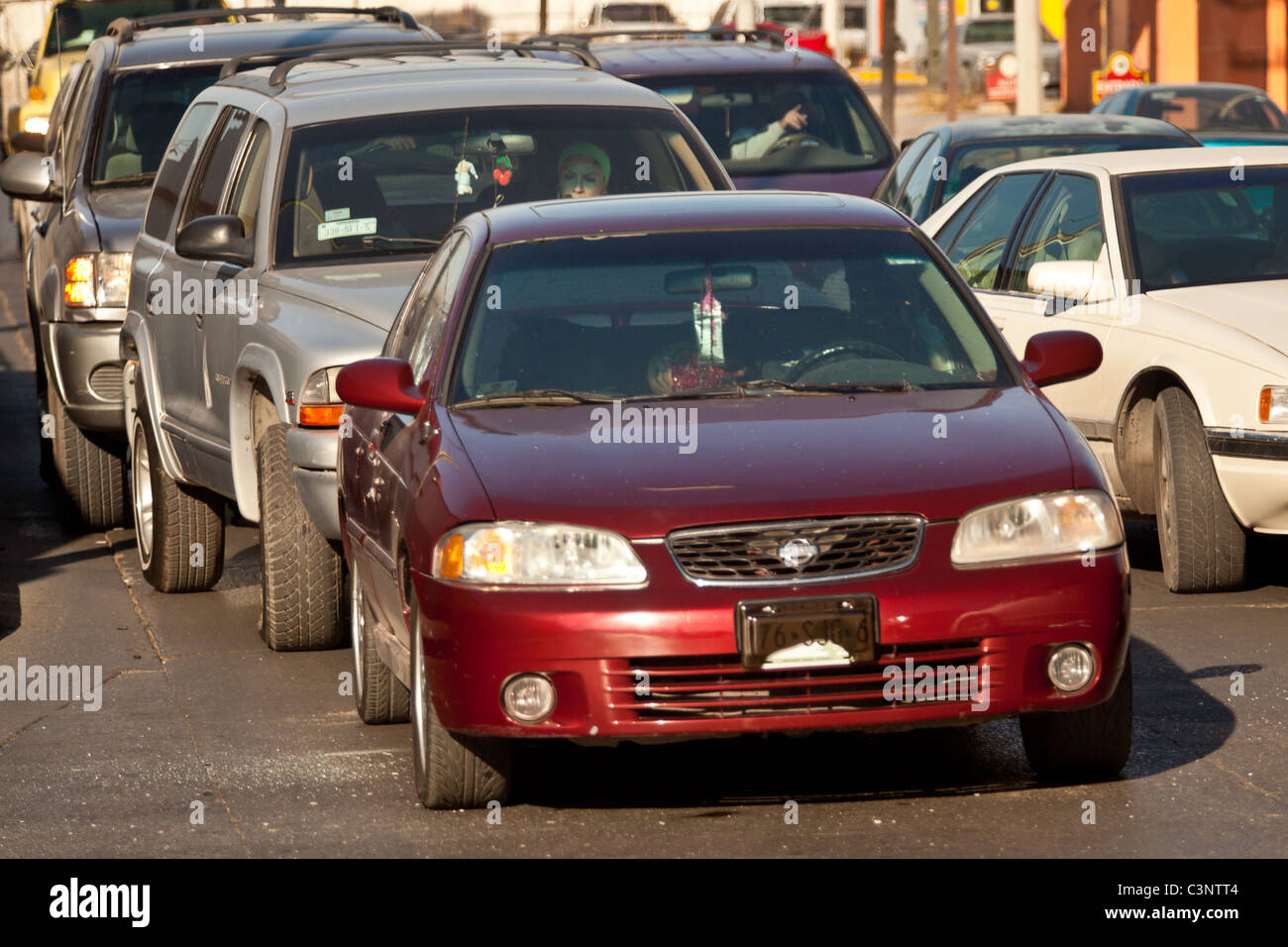 Traffic stops behind a vehicle of a driver executed moments earlier in the drug war Juarez, Mexico Stock Photo