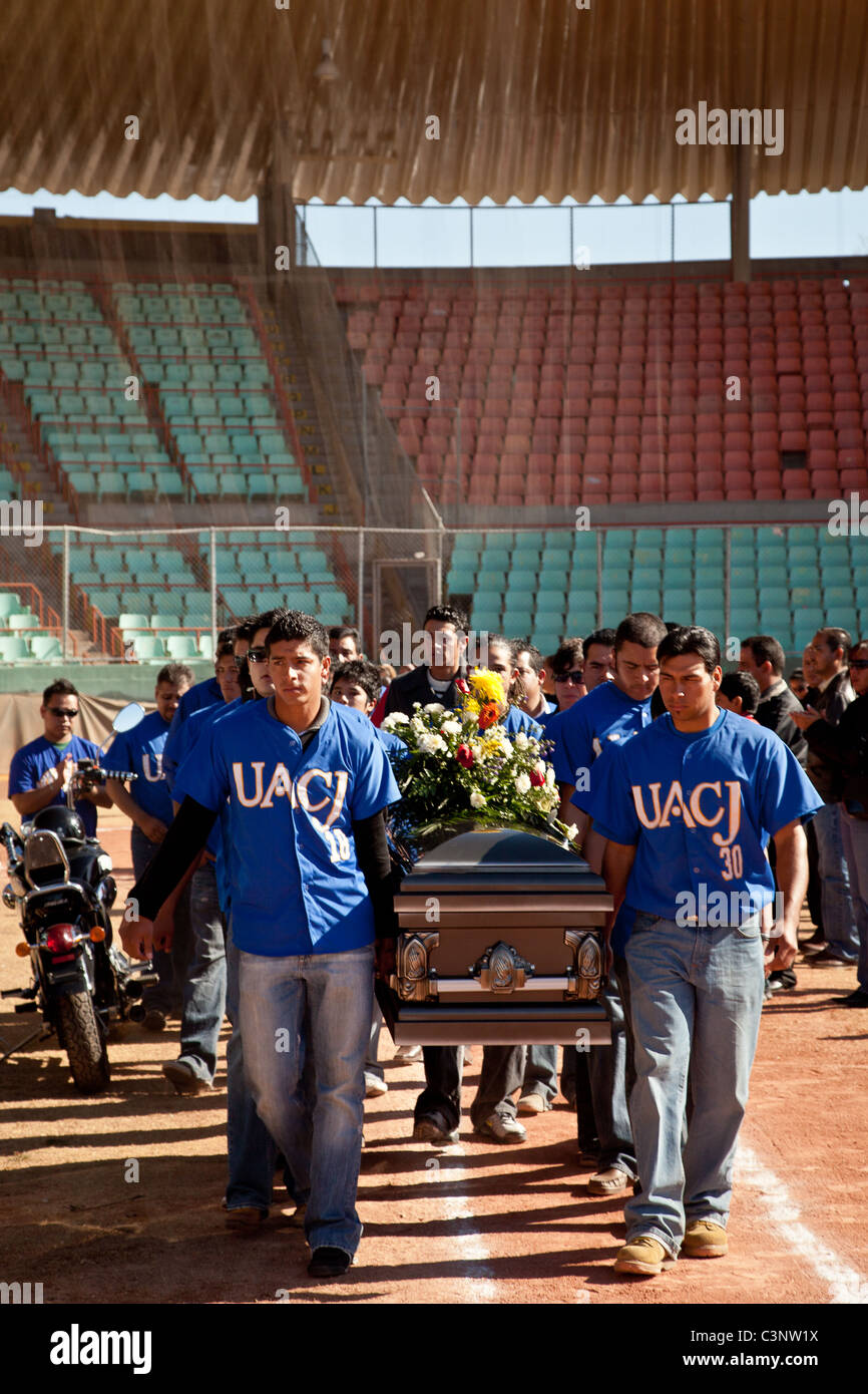 Teammates carry the coffin of a baseball player slain in the drug war