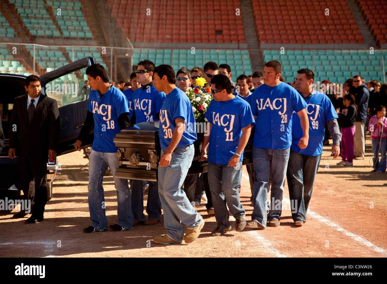 Teammates carry the coffin of a baseball player slain in the drug war