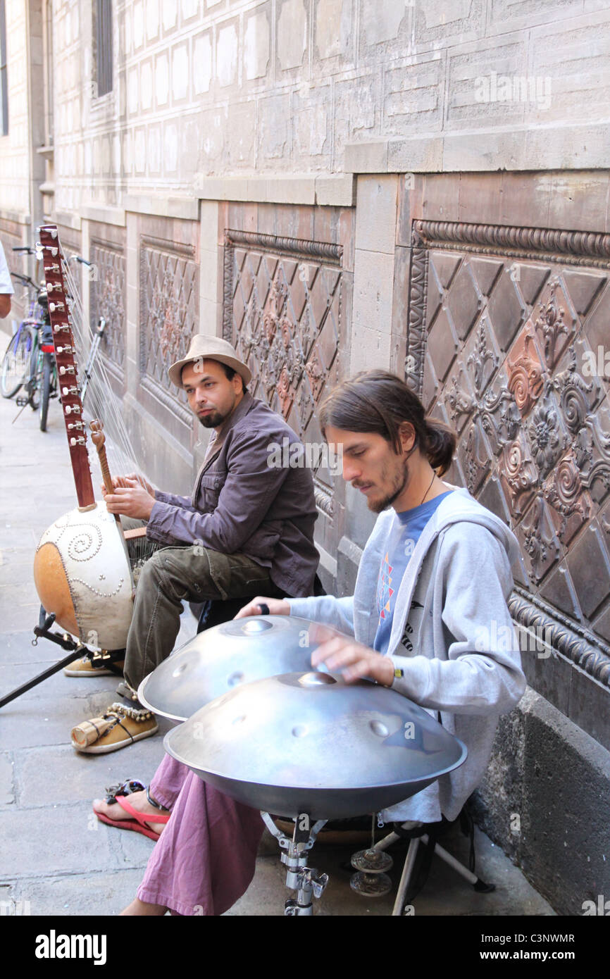 Street musicians busking in Barcelona, Spain. Stock Photo