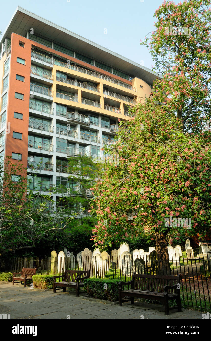 Bunhill Fields burial ground, gravestones with modern flats behind Islington but managed by the City of London England UK Stock Photo