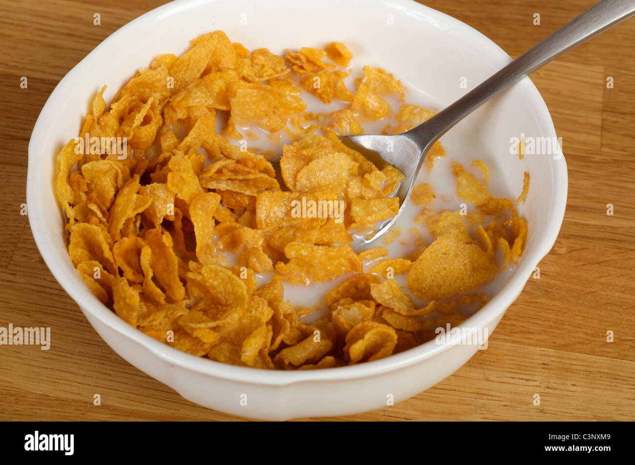 Half-eaten bowl of cornflakes Stock Photo