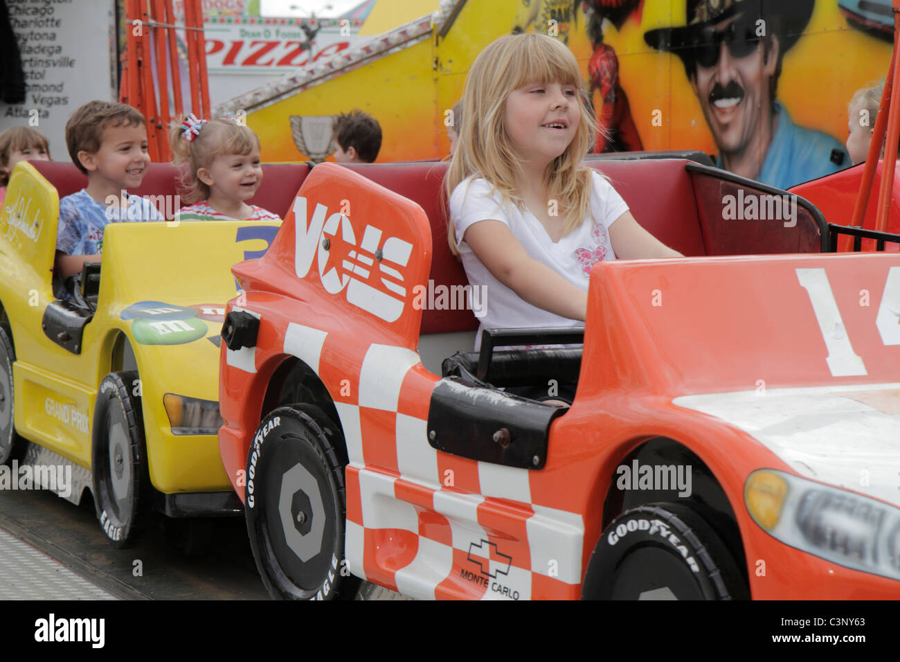 Plant City Florida,Florida Strawberry Festival,event,kiddy ride,carnival,girl girls,female kid kids child children youngster youngsters youth youths b Stock Photo