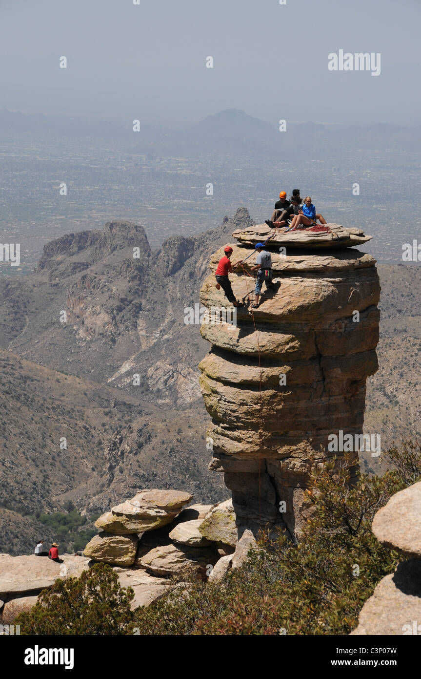 Rock climbers at the Hitchcock Pinnacle at Windy Point Vista on Mount Lemmon, Santa Catalina Mountains, Tucson, Arizona, USA. Stock Photo