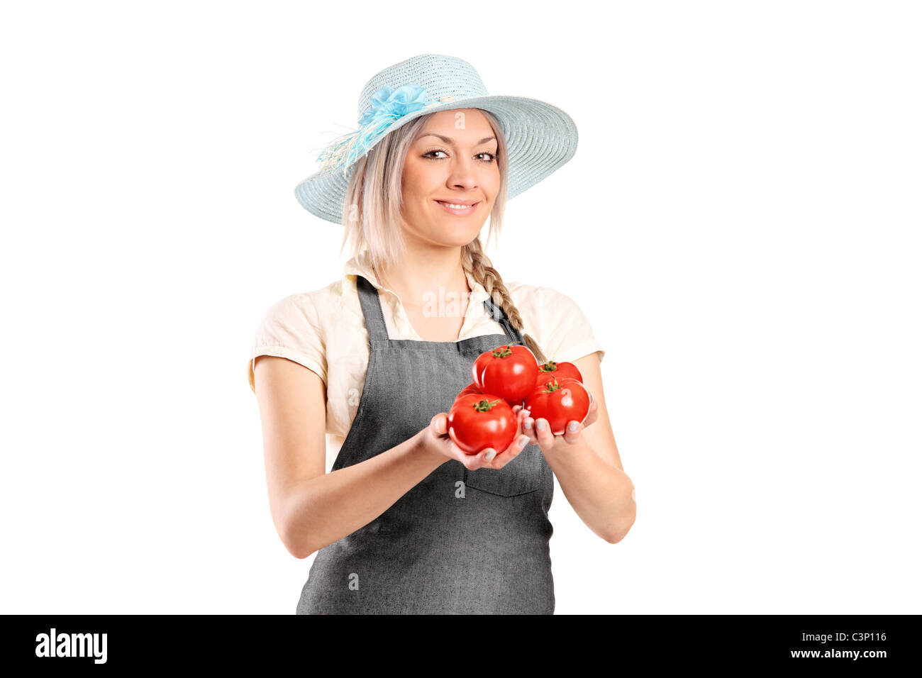 A female farmer holding tomatoes Stock Photo - Alamy