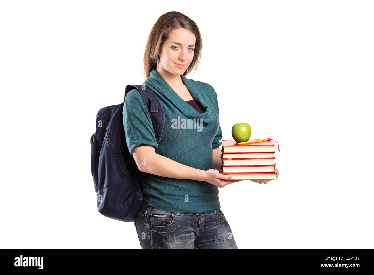 A smiling female student holding books and an apple Stock Photo - Alamy
