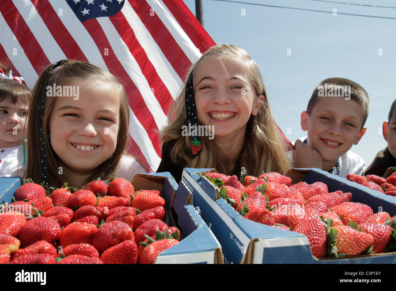 Florida,Hillsborough County,Plant City,South Evers Street,Florida Strawberry Festival,Grand Parade,strawberries,girl girls,female kid kids child child Stock Photo