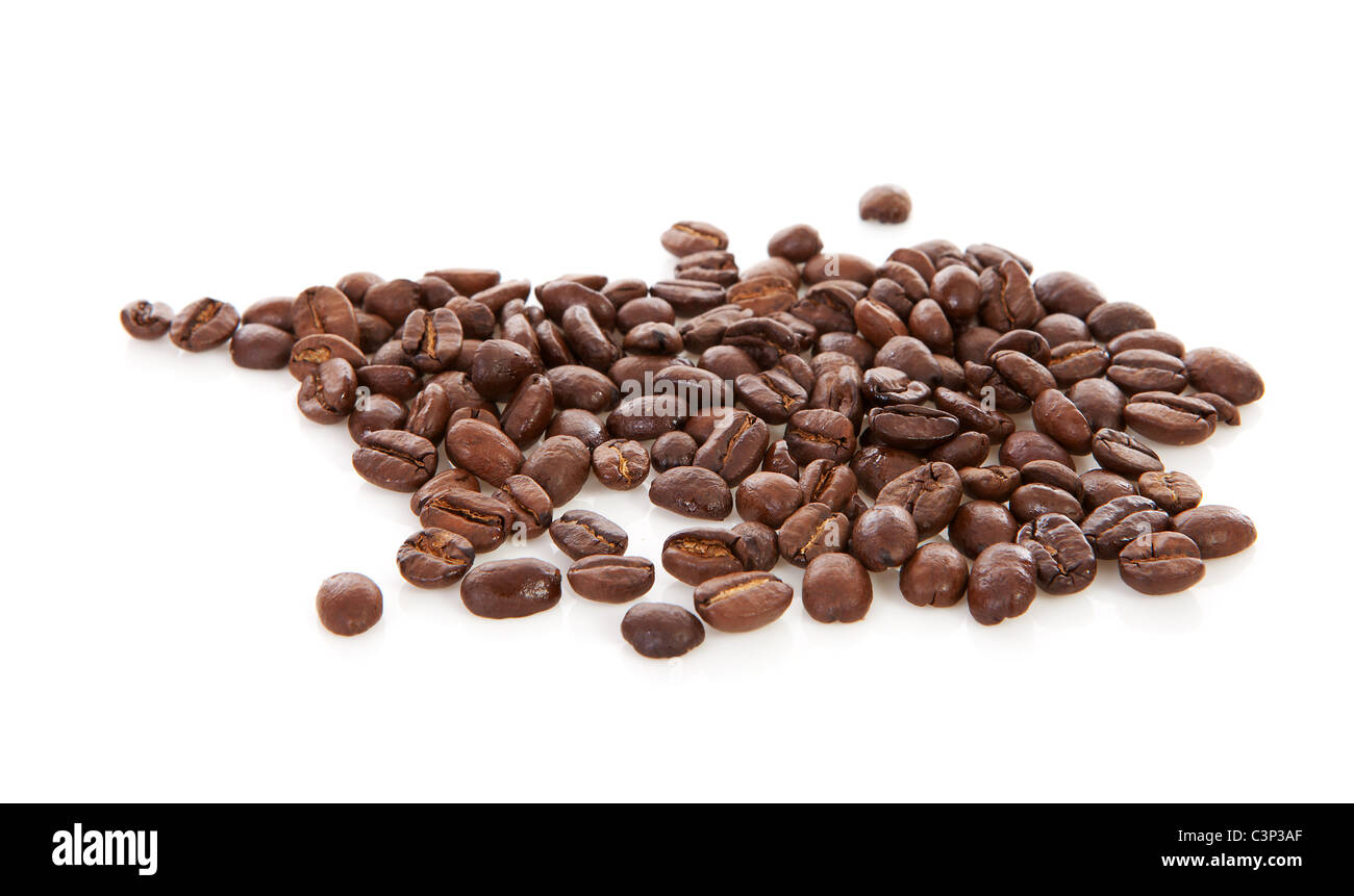 Pile of roasted coffee beans over white background Stock Photo - Alamy