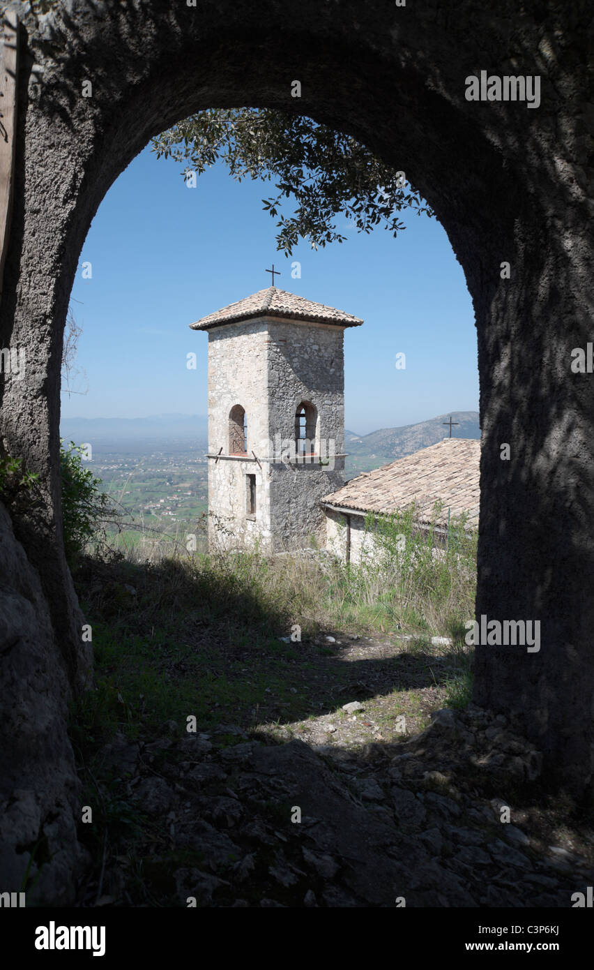 St Thomas Aquinas medieval church bell tower as seen through arch, next to family castle ruins in Roccasecca, Italy. Stock Photo