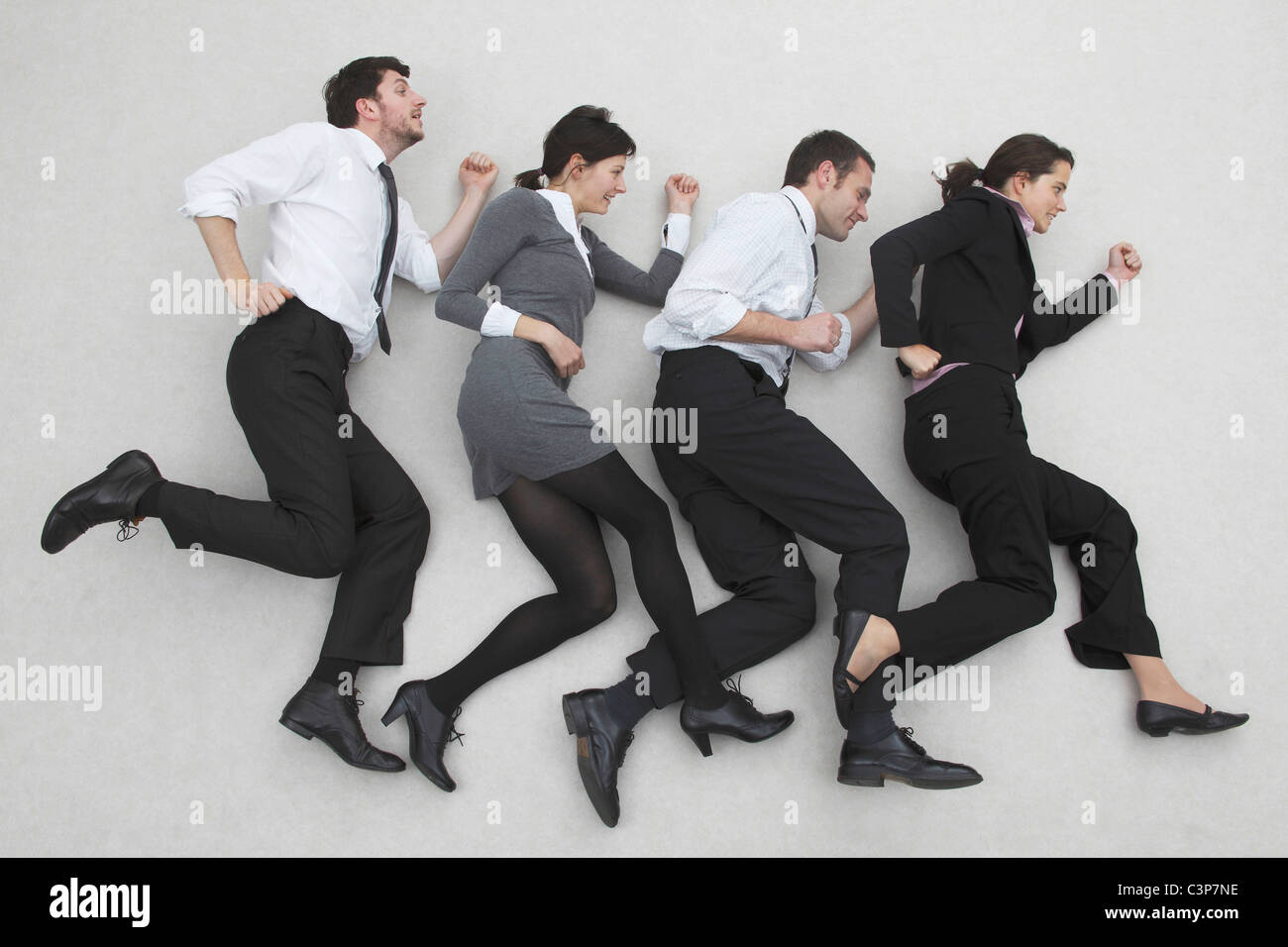 Office workers in a line, side view, portrait, elevated view Stock Photo