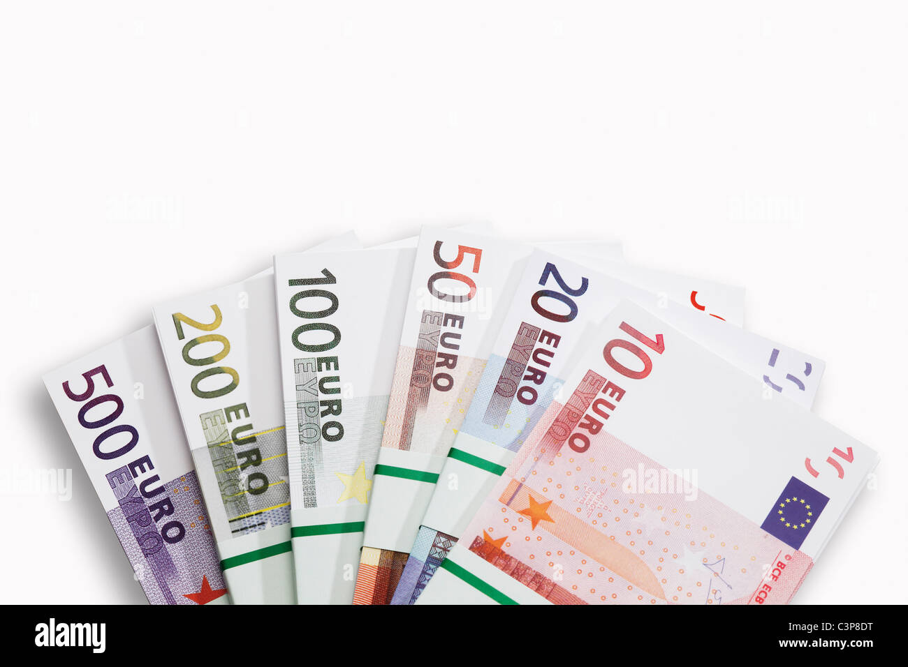 Bundles of Euro banknotes on white background, close-up Stock Photo