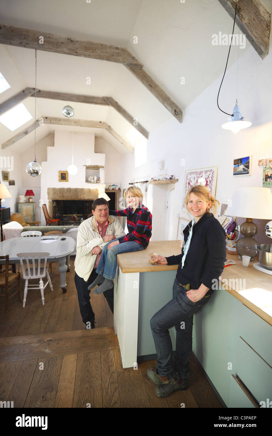 Family in farmhouse kitchen, Cornwall, UK. Stock Photo