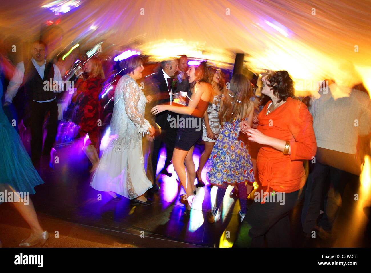 Guests Dancing At A Wedding Reception With Intentional Blur Stock