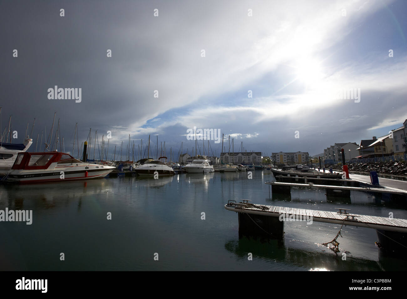 stormy bad weather clearing over marina harbour in the uk Stock Photo
