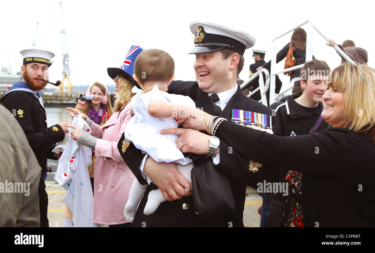 Crew members of HMS Cumberland are welcomed home by family and friends. Stock Photo